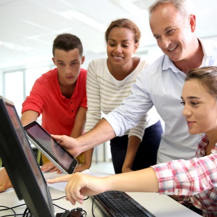 A group of students working at a table together