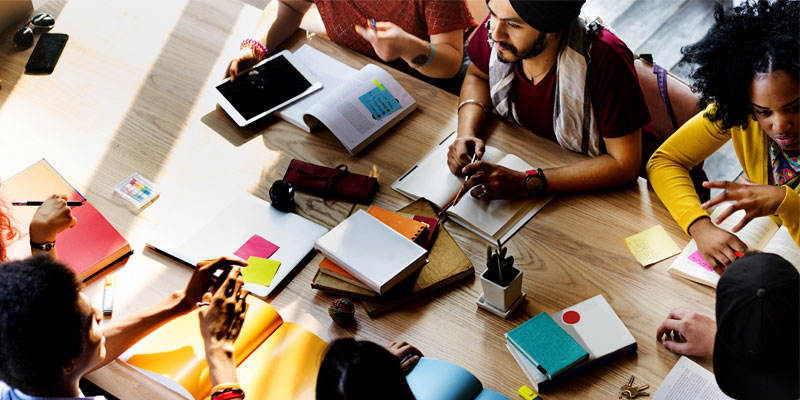 A group of students working at a table together